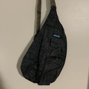 Black and gray Kavu Sling backpack